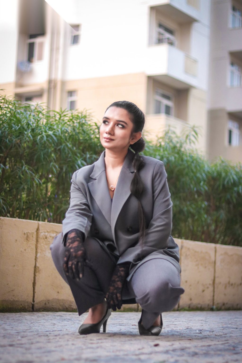 Sakshi Jethwani in a grey suit outdoors