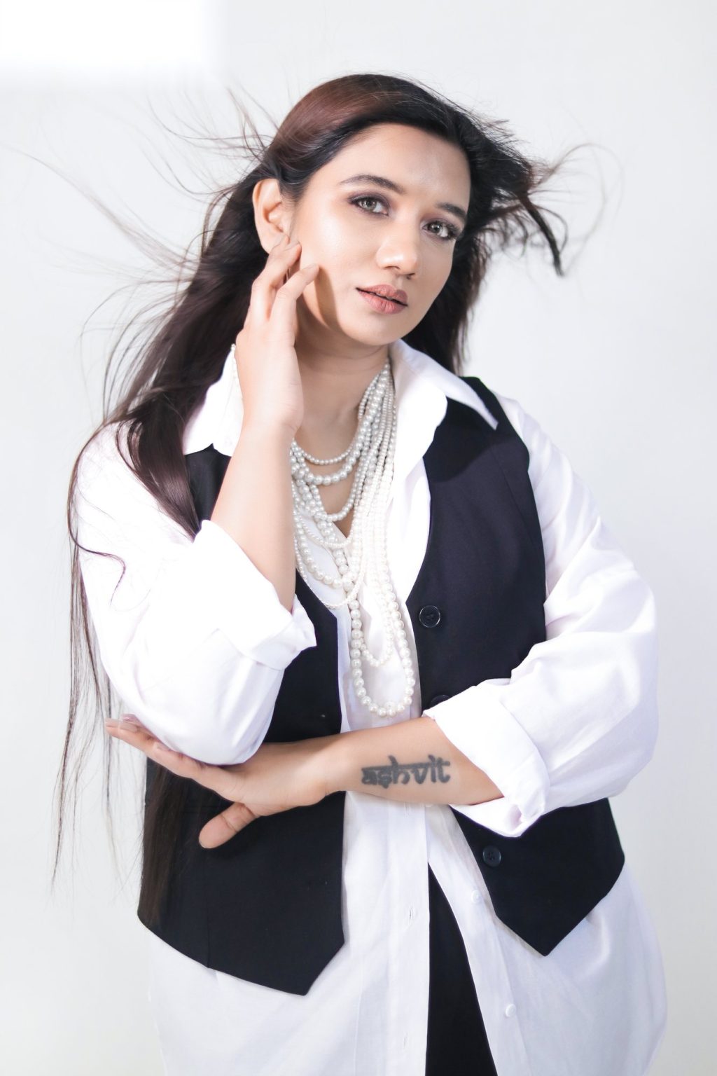 Sakshi Jethwani, hair in motion, white shirt and black waistcoat