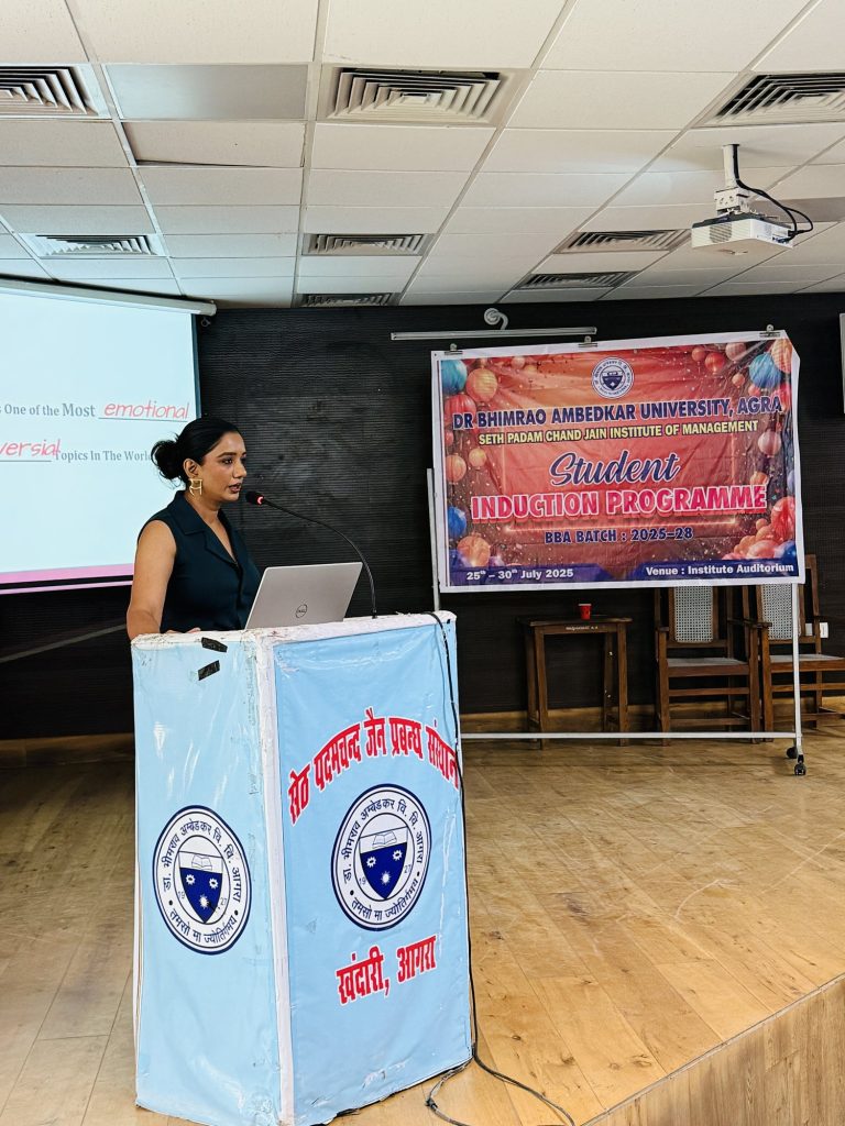 Sakshi Jethwani speaking at a university podium